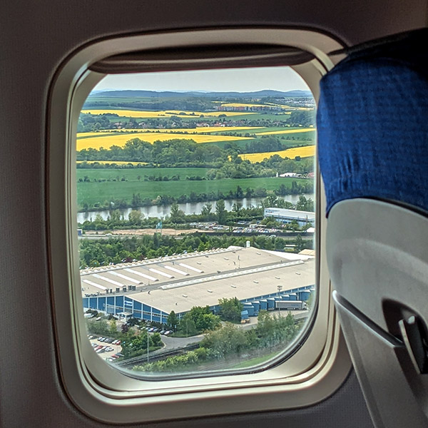 Looking out the window as the plane lands in Prague